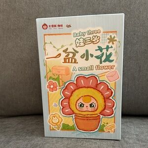 Baby Three A Small Flower Doll